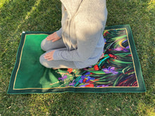 Load image into Gallery viewer, Artists self expression canvas inspired to convey the soul connection of mind body and soul. Empowering artists and artisans. Hand painted hints of gold scattered throughout the serenity mat. The artisanal redefinition of prayer and meditation mats. Life serenity mat by Fairuz Hamad. Nature flowers colors a garden of connection and consciousness. Woman in prayer in islam outdoor garden scene