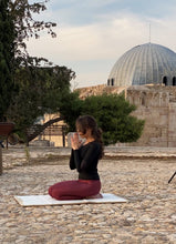 Load image into Gallery viewer, Sustainable hand tailored empowering and supporting small businesses and artisans for social impact and economic support. Local artisans are invovled every step of the way with this linen cotton fabric and gold embroidered trimming inspired by arabian culture and arab social status implying power and wealth. Meditation, prayer and serenity mats or rugs. padded with local sourcing and suppliers. Bishtu serenity mat by A'myn, Woman meditating praying at citadel ummayyad palace jordan