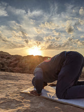 Load image into Gallery viewer, Sustainable hand tailored empowering and supporting small businesses and artisans for social impact and economic support. Local artisans are invovled every step of the way with this linen cotton fabric and gold embroidered trimming inspired by arabian culture and arab social status implying power and wealth. Meditation, prayer and serenity mats or rugs. padded with local sourcing and suppliers. Bishtu serenity mat by A'myn, Man praying islam at sunset in wadi rum jordan outdoor lifestyle